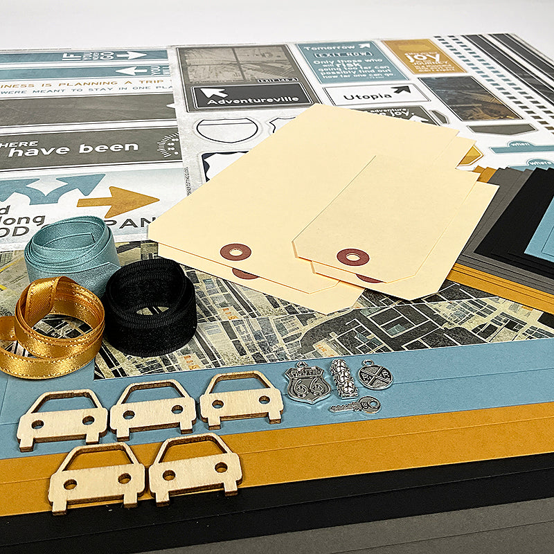 Collection of paper cutouts, envelopes, and small decorative items on a textured surface.