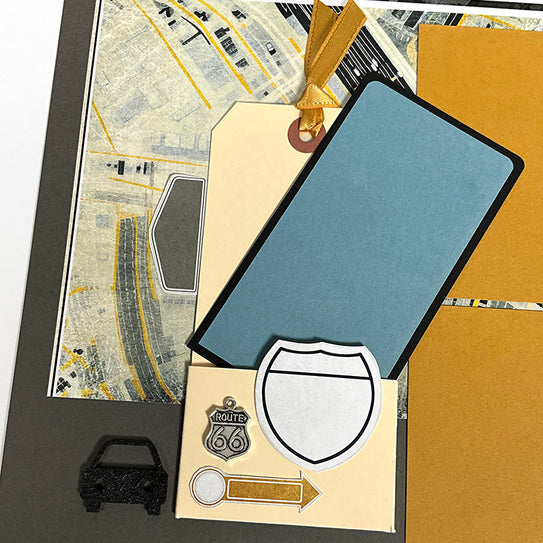 Collection of Route 66-themed items including a map, shield emblem, and decorative elements on a textured surface.